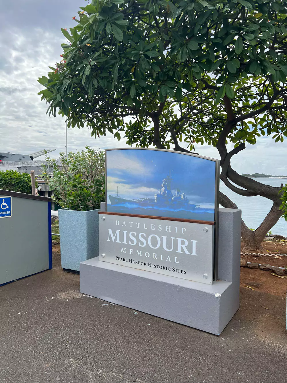 Entrance sign for the Battleship Missouri Memorial at Pearl Harbor, Oʻahu, featuring bold lettering.