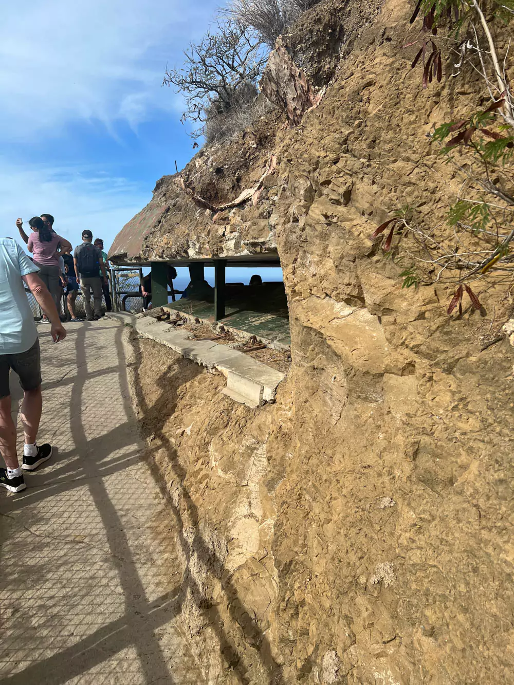 Concrete pillbox at the summit of Diamond Head State Monument, offering panoramic views of Waikīkī, the coastline, and Pacific Ocean from its historic World War II-era lookout.