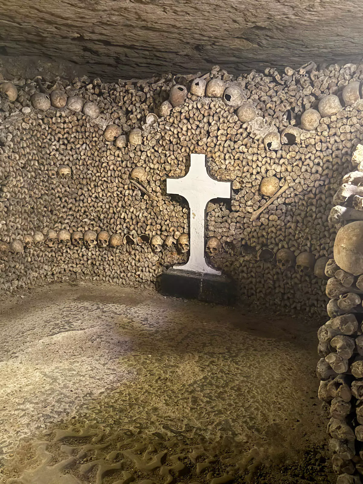 Cross amongst decoratively laid bones.