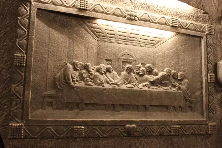 Salt-carved depiction of The Last Supper in the Chapel of St. Kinga at the Wieliczka Salt Mine, showcasing intricate detail sculpted directly into the rock salt wall.