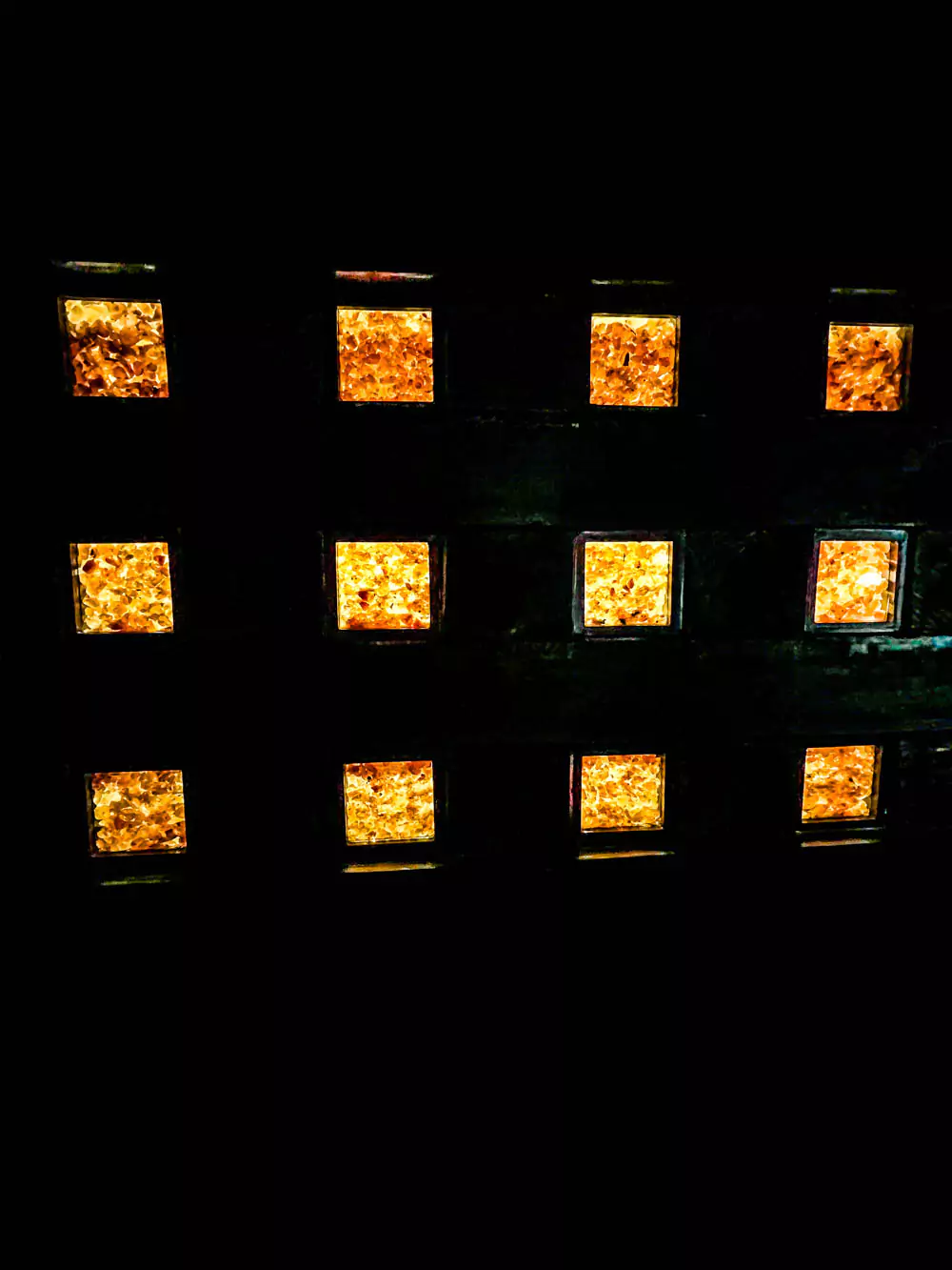 Neatly stacked salt squares on display at the Hallstatt Salt Mine (Salzwelten) in Austria, showcasing compact, white blocks used for trade and preservation. The exhibit highlights the historic value and craftsmanship of salt production in the region.
