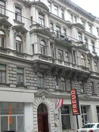 Exterior of the Sigmund Freud Museum in Vienna, Austria, located in Freud’s former residence and office, featuring a modest façade with signage and informational plaques marking the birthplace of psychoanalysis.
