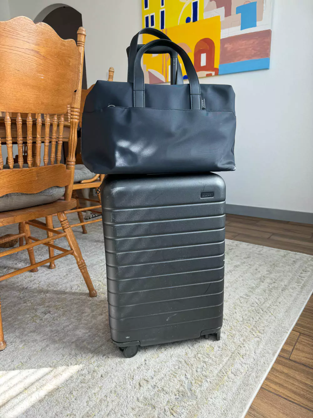 AWAY Bigger Carry-On Suitcase paired with the Everywhere Bag, both in matching sleek finishes, designed for seamless travel with durable materials, smart compartments, and a modern aesthetic — a perfect travel duo