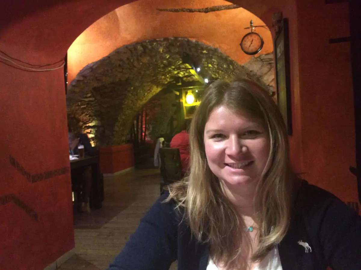 Katie dining or posing at the Slovak Restaurant and Pub in Banská Bystrica