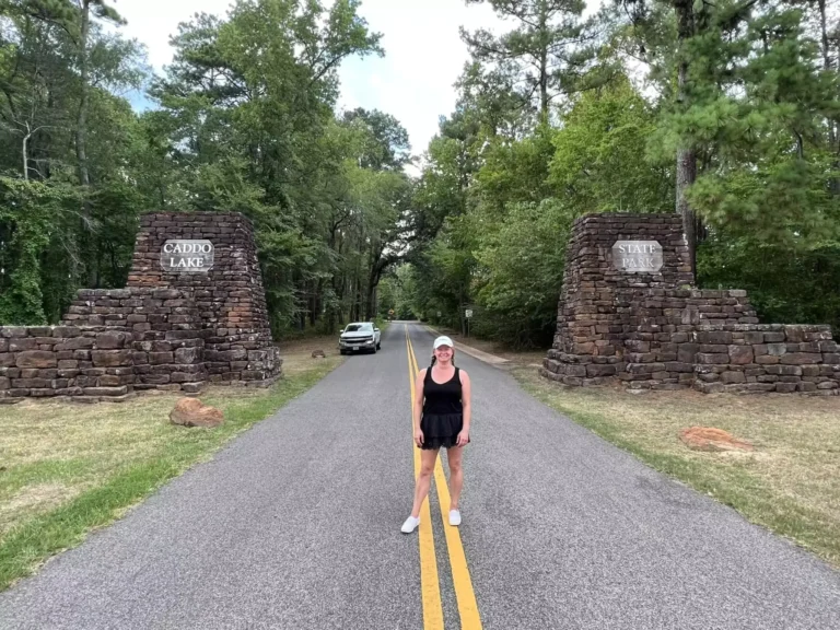 Katie standing at the entrance to caddo lake state park