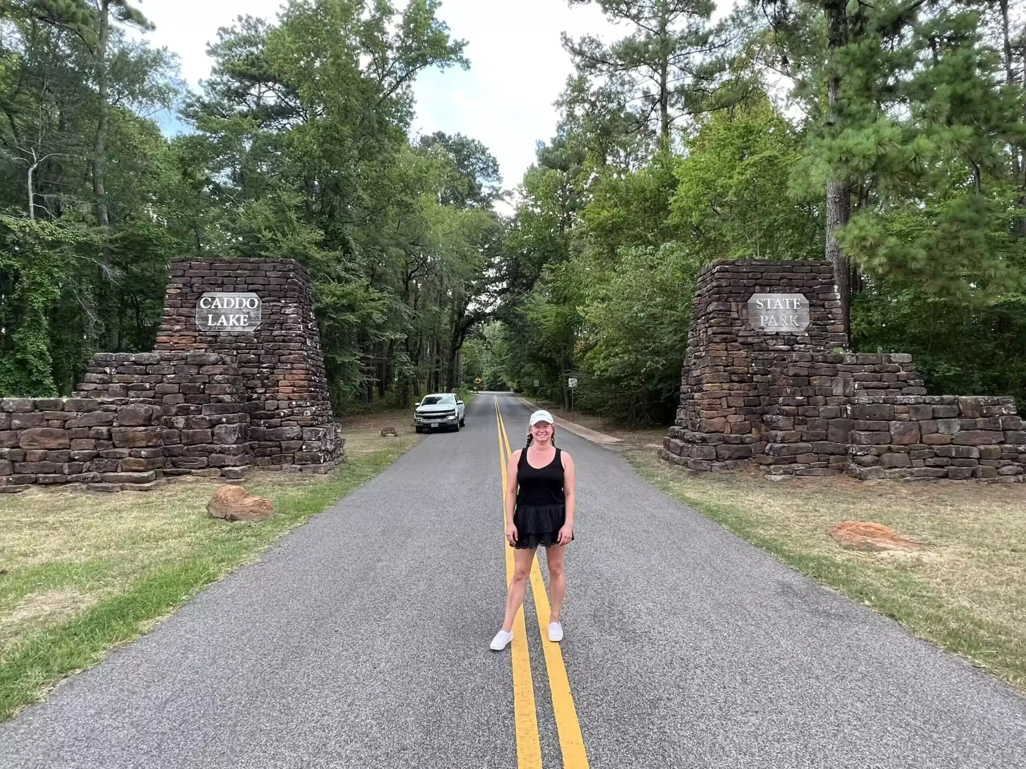 Katie standing at the entrance to caddo lake state park