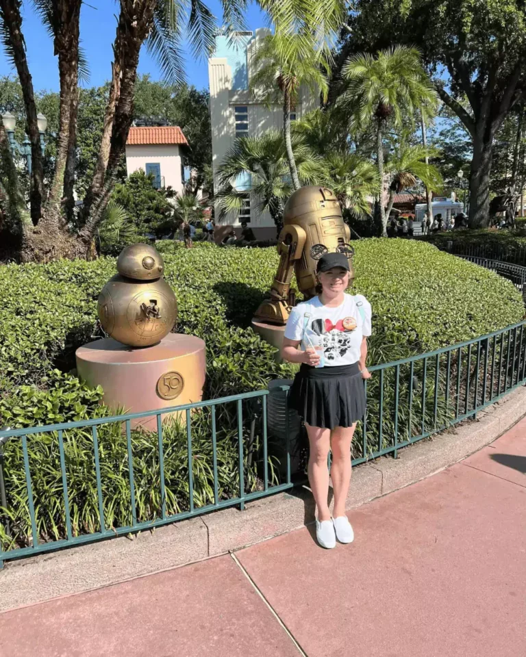 katie in front of star wars r2d2 statue at disney hollywood studios