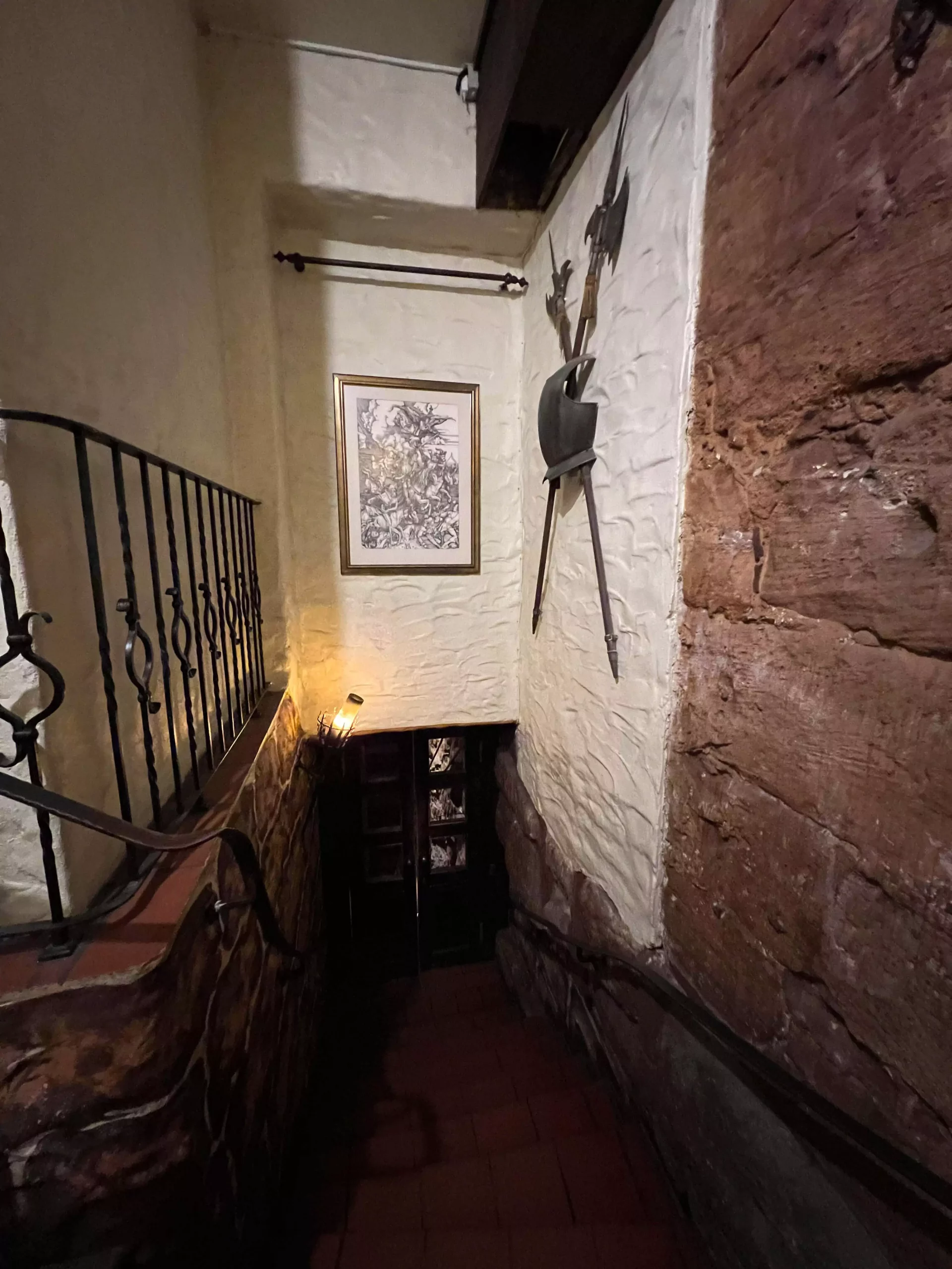 The entrance to Im Keller in Nuremberg, Germany, marked by an ornate coat of arms above a wooden door set in a stone facade. The historic emblem and architecture hint at the building’s deep-rooted heritage and medieval charm.