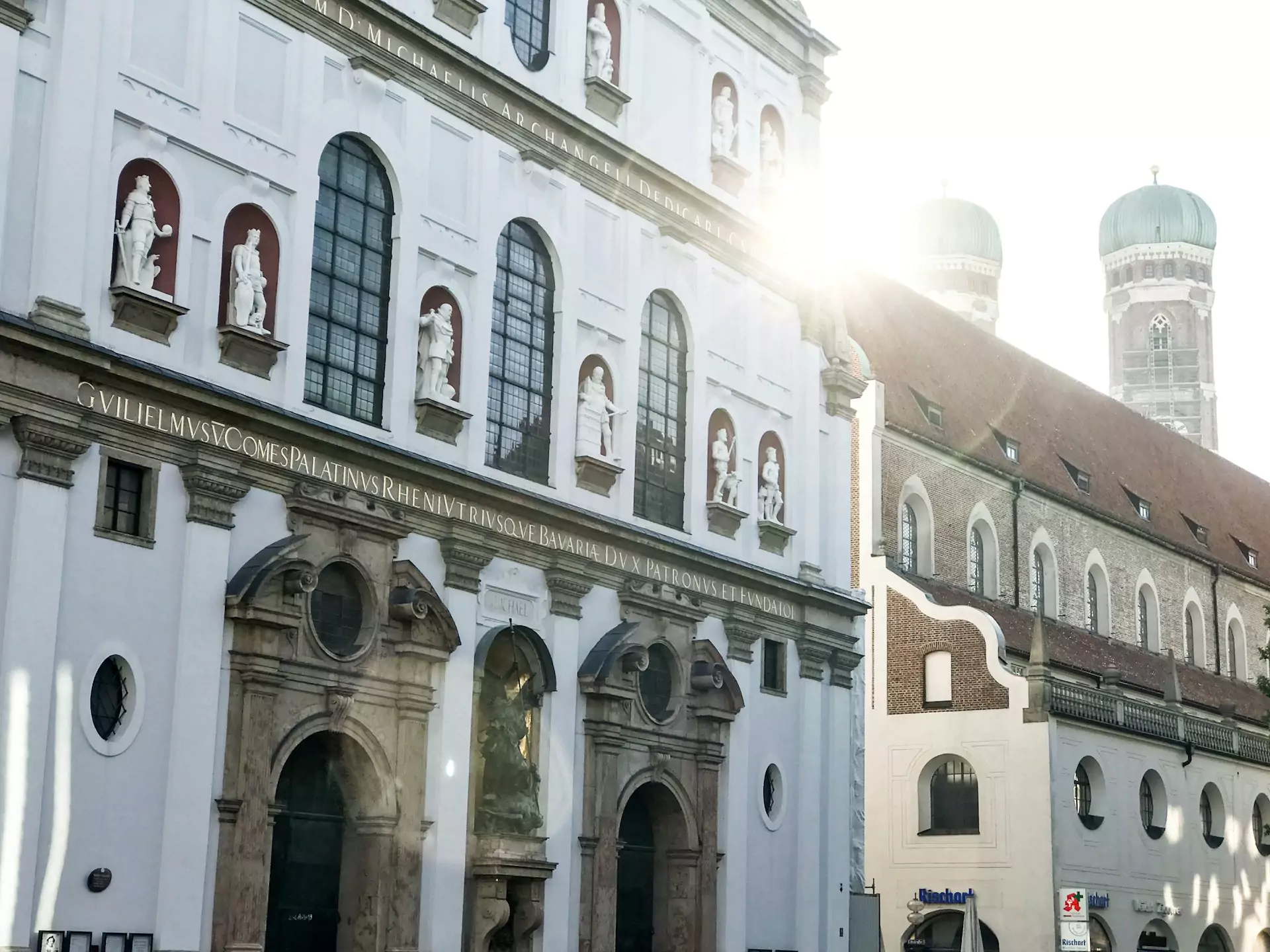 Kaufingerstrasse in Munich, Germany, a busy pedestrian shopping street lined with modern stores and historic architecture, filled with shoppers and tourists in the heart of the city.