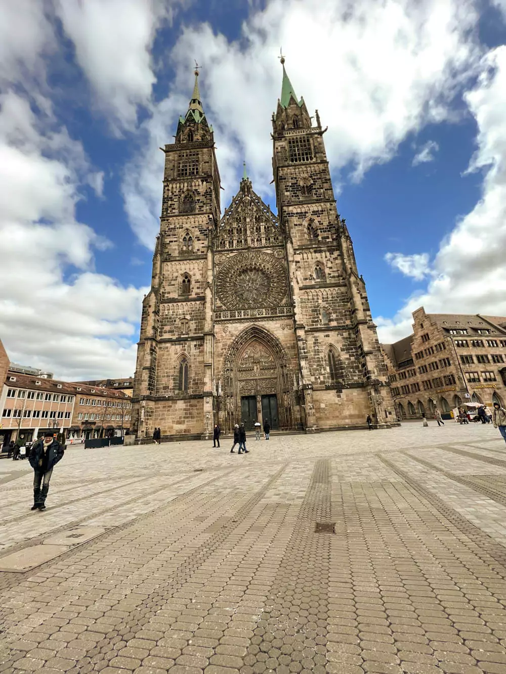St. Lorenz Church in Nuremberg, a Gothic masterpiece with twin spires, stained glass windows, and the famous Angelic Salutation sculpture by Veit Stoß.