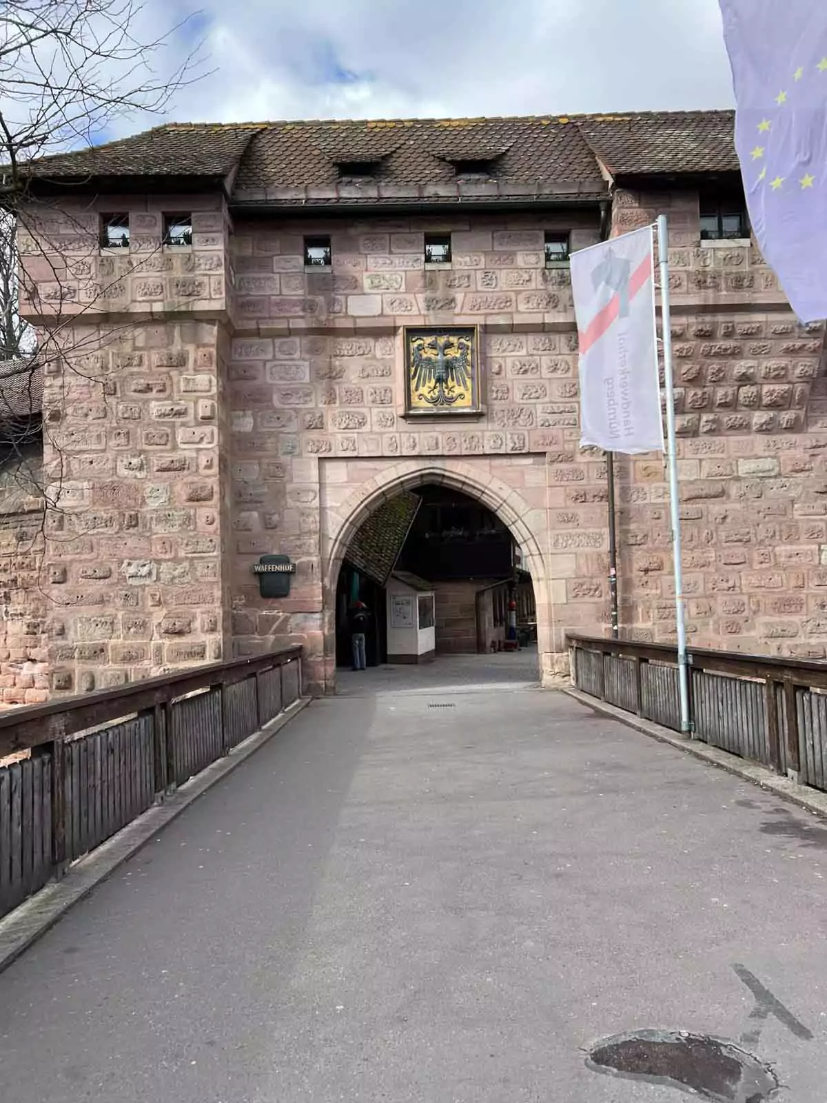 The historic Frauentor gate in Nuremberg, Germany, a medieval city entrance near the iconic Frauentorturm and Handwerkerhof crafts market.