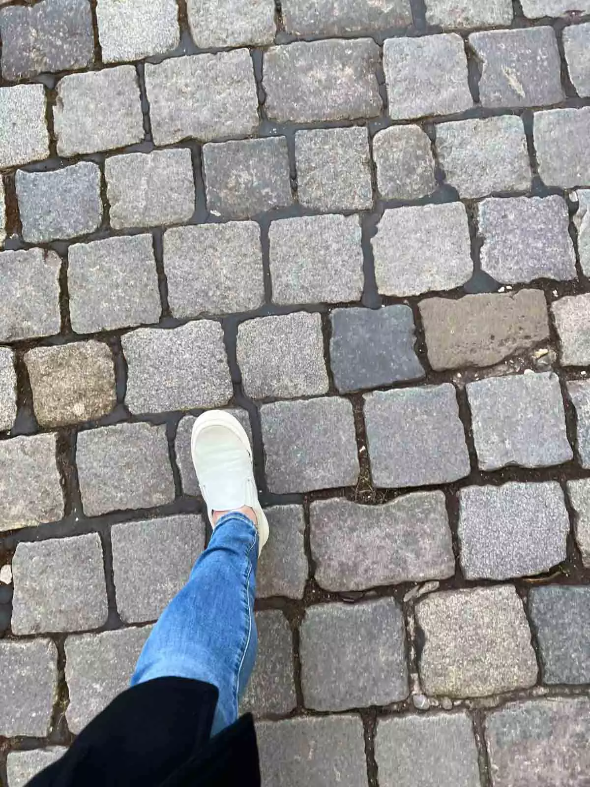 Katie's foot while walking through old town's cobblestone streets