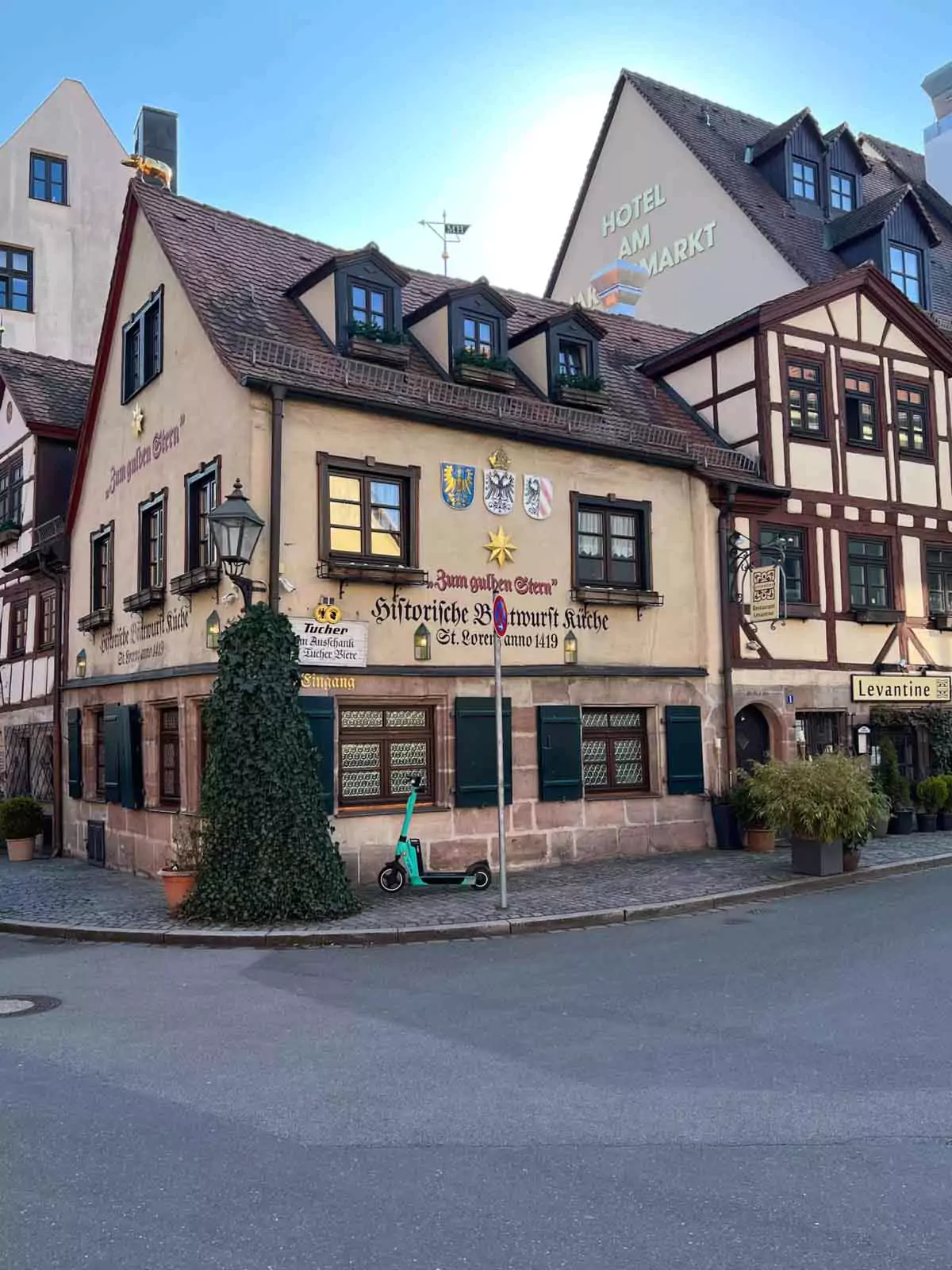 Exterior of Zum Gulden Stern in Nuremberg, Germany—one of the world’s oldest bratwurst restaurants—featuring a historic half-timbered facade, red shutters, and traditional signage in Nuremberg’s Old Town.