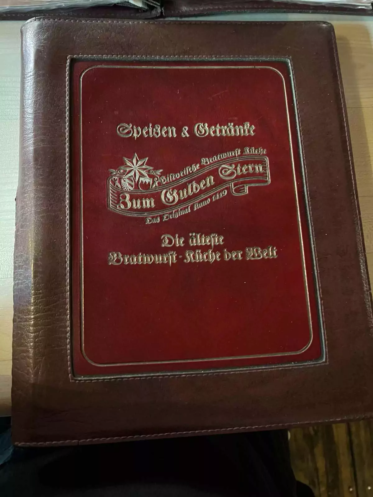 Menu from Zum Gulden Stern in Nuremberg, Germany, featuring traditional Franconian dishes like grilled bratwurst, sauerkraut, potato salad, and regional beer options