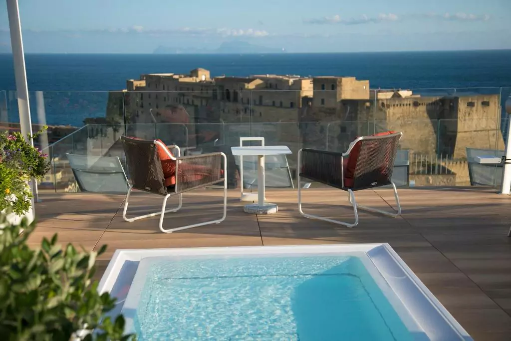 Grand Hotel Vesuvio in Naples, Italy, a luxurious waterfront hotel featuring elegant architecture, balconies overlooking the Bay of Naples, and proximity to Castel dell’Ovo