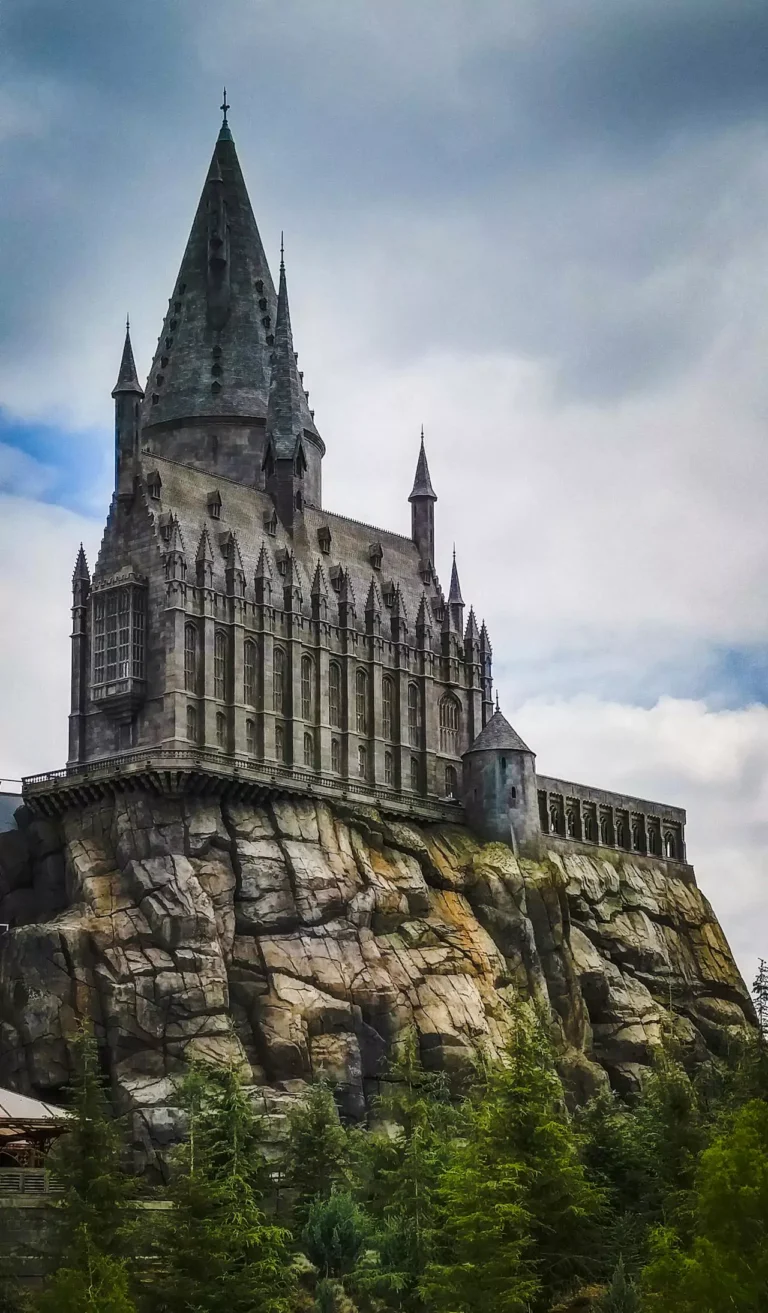 Replica of Hogwarts Castle at Universal Studios, with towering spires and detailed stonework, set within The Wizarding World of Harry Potter theme park, capturing the magical look of the films.