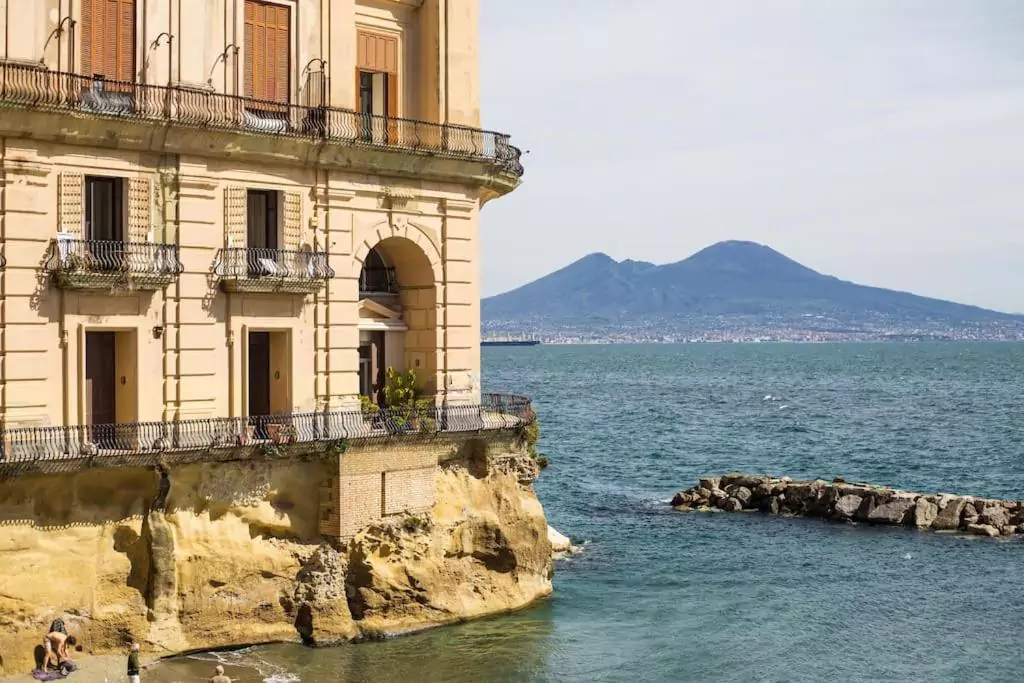 Il Richiamo Del Mare in Naples, Italy, featuring a serene guest room with coastal-inspired decor, light blue accents, and modern comforts just steps from the sea