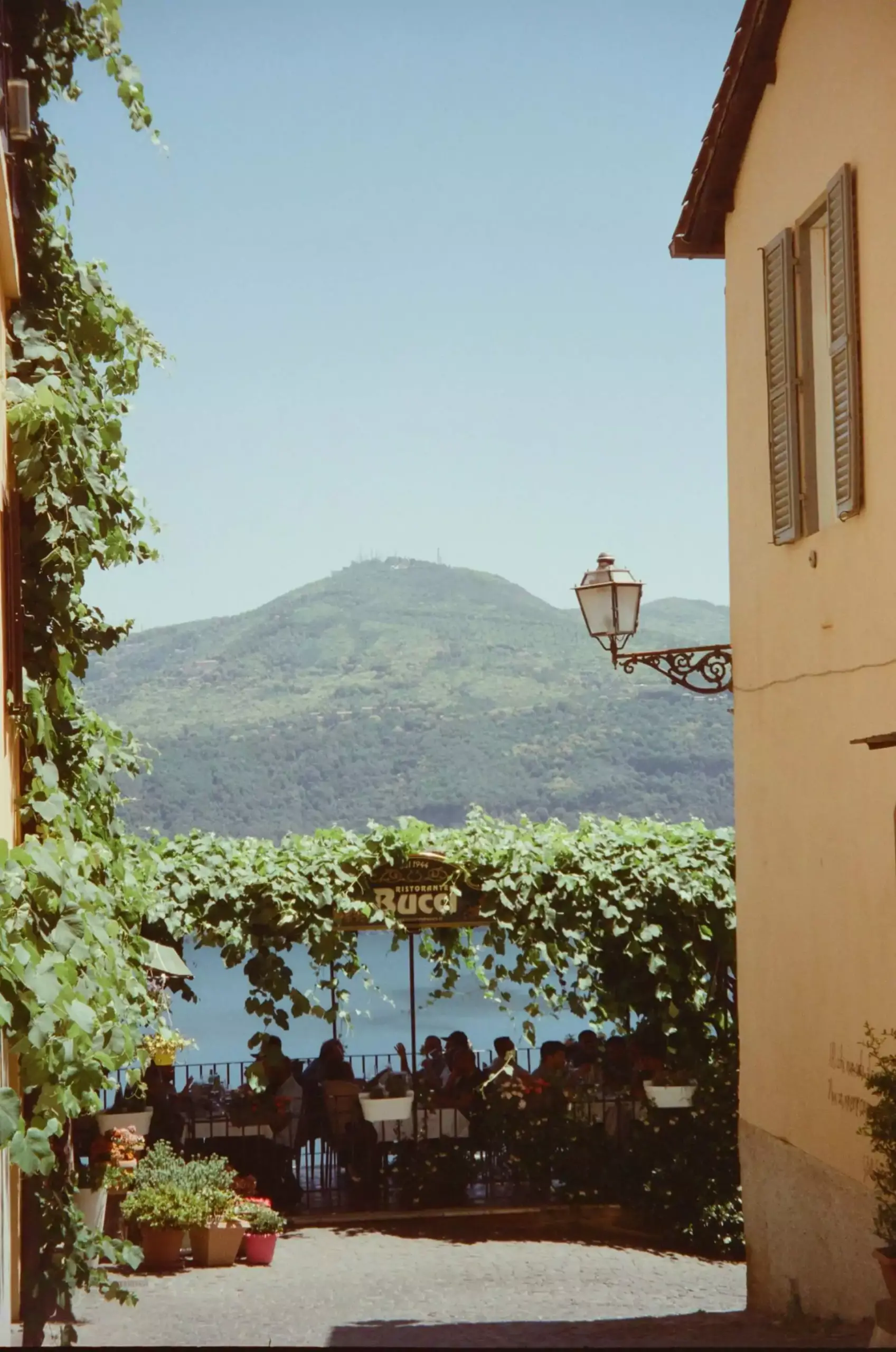 Castel Gandolfo in Italy, a hilltop town overlooking Lake Albano, known for the Papal Palace and its lush gardens, with historic architecture and panoramic views of the surrounding countryside.