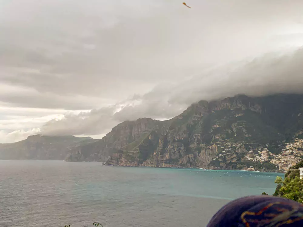 Dramatic mountains rising above the turquoise sea along the Amalfi Coast in Italy
