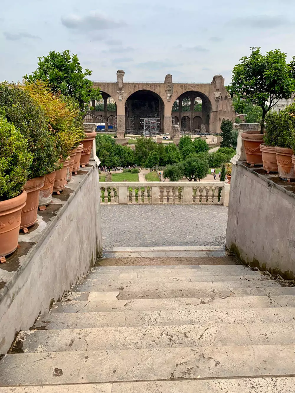 Ruins of the Basilica of Maxentius in the Roman Forum, Rome, featuring massive vaulted arches and towering brick structures that once formed one of the largest buildings in ancient Rome.