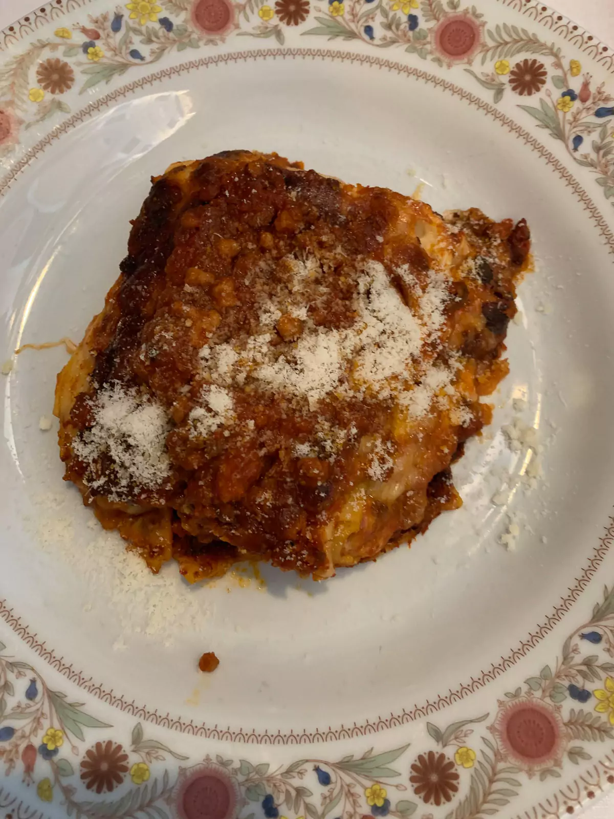 Baked lasagna at Ristorante Alessio in Rome, Italy, served bubbling hot with layers of pasta, rich meat sauce, and melted cheese — a comforting and flavorful dish