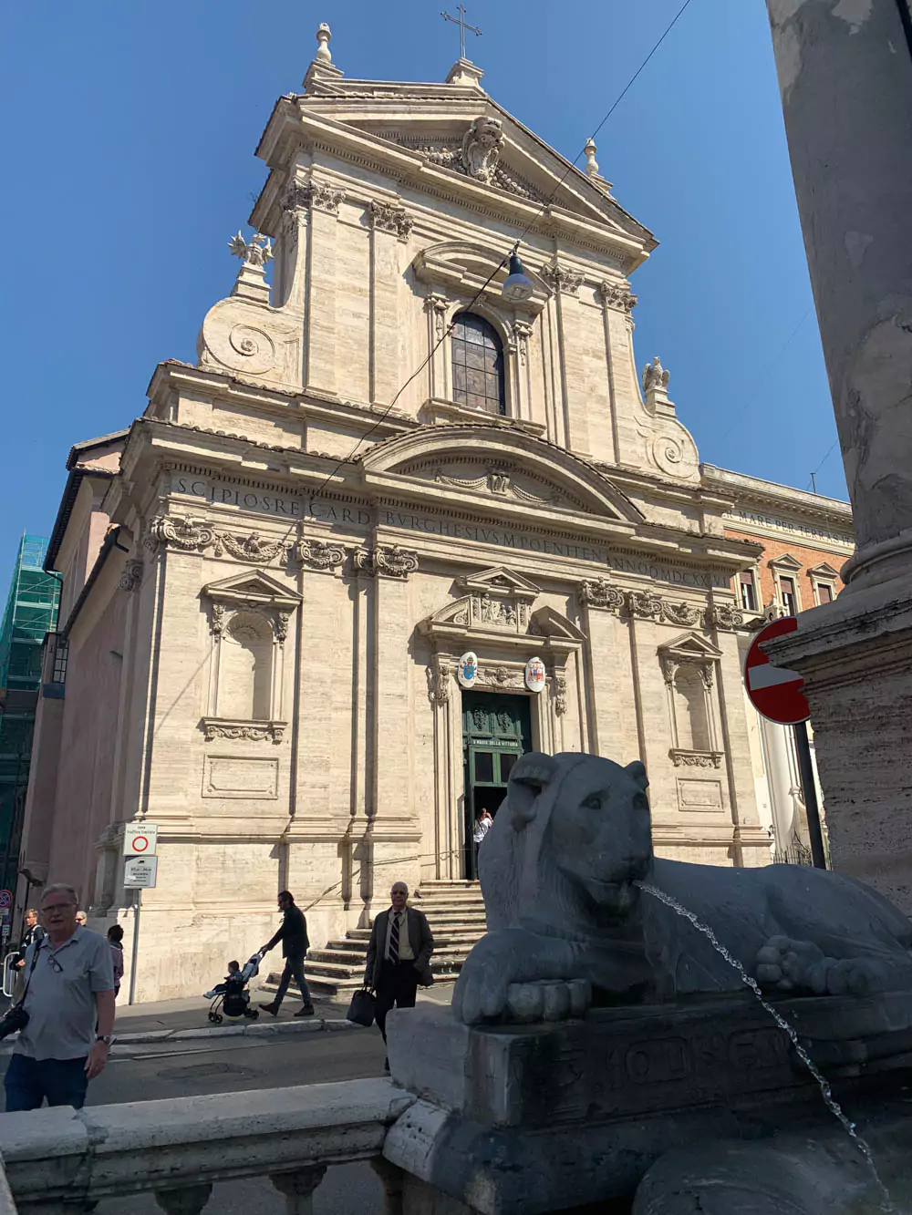 Exterior of Santa Maria della Vittoria in Rome, Italy, showcasing its ornate Baroque facade with sculpted columns, decorative stonework, and a grand entrance. The historic church is known for housing Bernini’s famous sculpture, The Ecstasy of Saint Teresa.