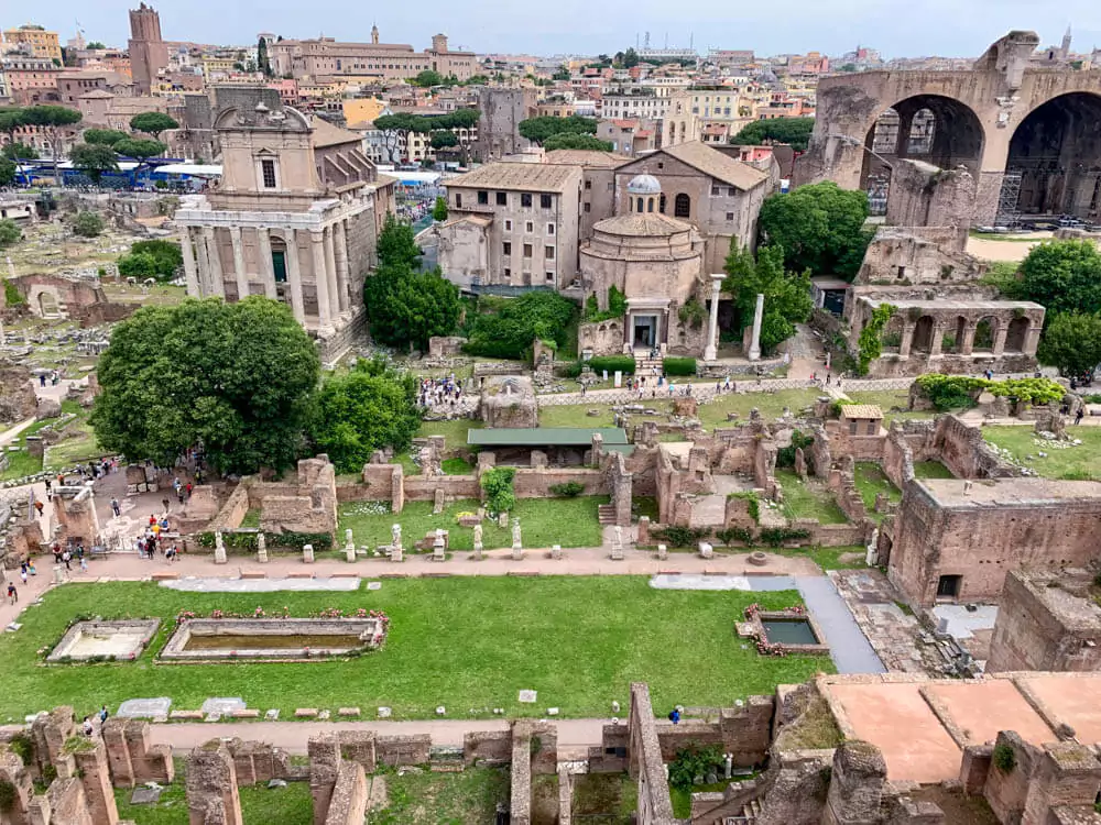 The House of the Vestal Virgins in the Roman Forum, featuring the remains of courtyards, columns, and statues, once home to the priestesses who maintained the sacred fire of Vesta in ancient Rome.