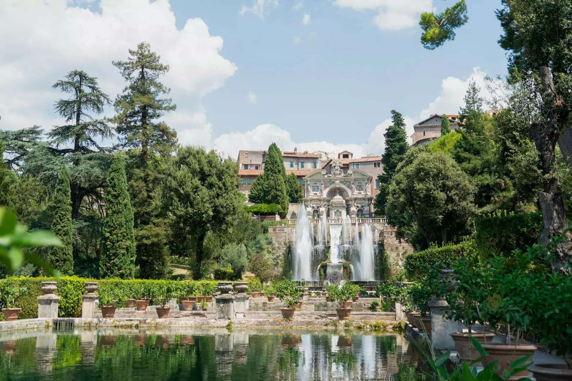 Villa d’Este in Tivoli, Italy, a Renaissance villa known for its elaborate gardens and fountains, featuring cascading water, sculpted terraces, and classical statues surrounded by greenery.