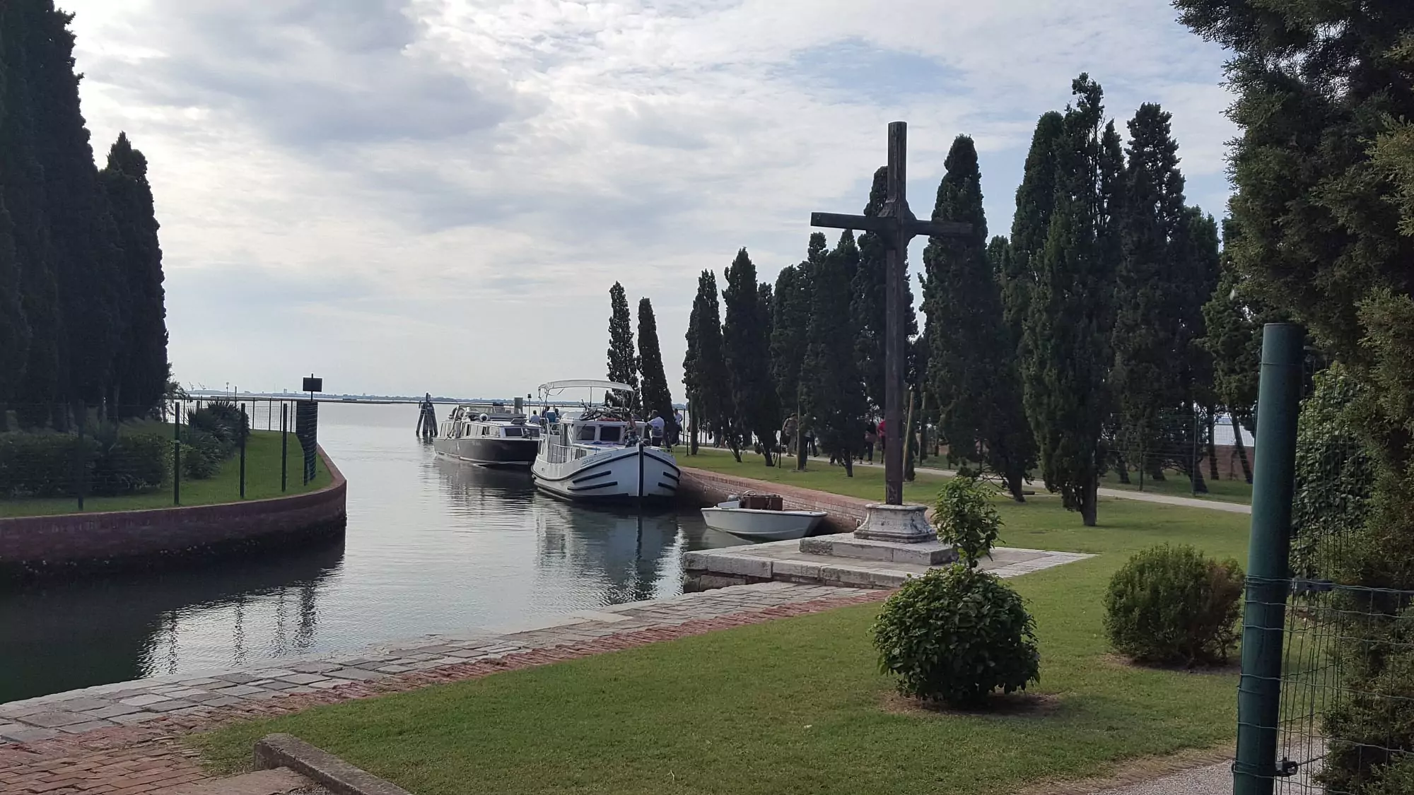 San Francesco del Deserto, a quiet Franciscan monastery on a small island in the Venetian Lagoon, surrounded by cypress trees and gardens, offering a serene retreat with views of the water.