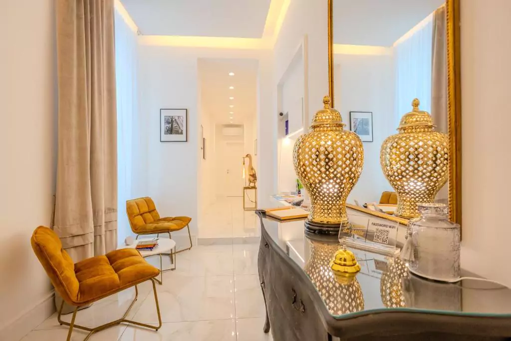 La Corte dei Mille Luxury in Naples, Italy, featuring a modern and elegant guest room with neutral tones, soft lighting, and upscale amenities in the heart of the stylish Chiaia district