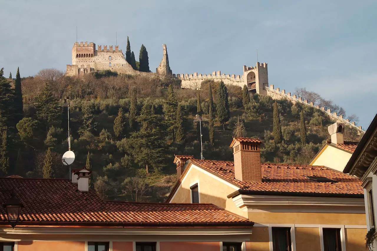 Aerial view of Marostica, Italy, showing the medieval city walls, castle, and large chessboard square used for the town's famous human chess game