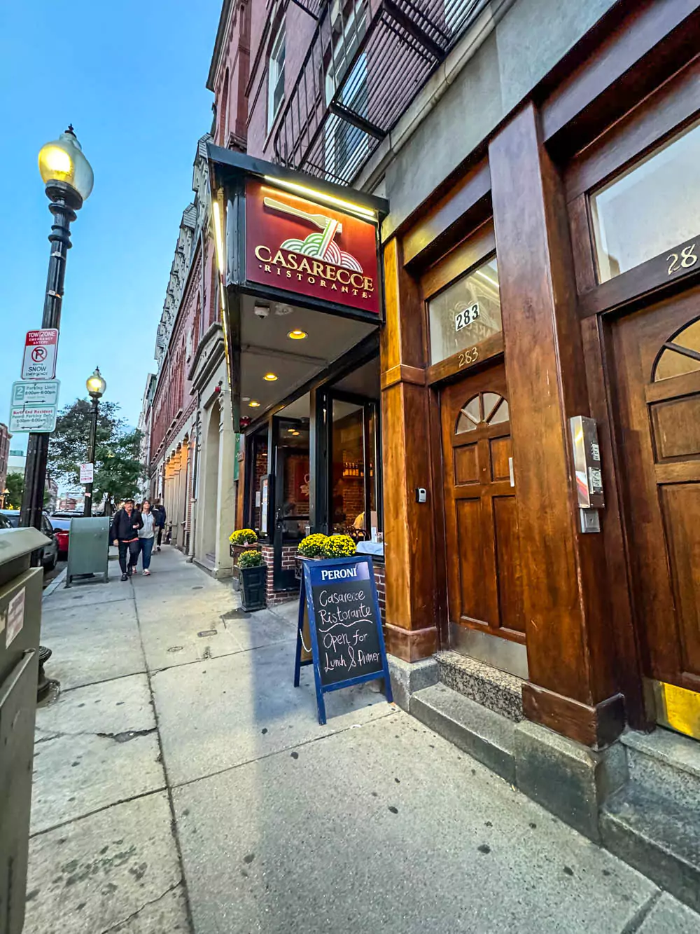 Exterior of Casarecce Ristorante in Boston’s North End, with a cozy brick facade, welcoming signage, and outdoor seating. The Italian eatery captures the neighborhood’s old-world charm and culinary reputation.