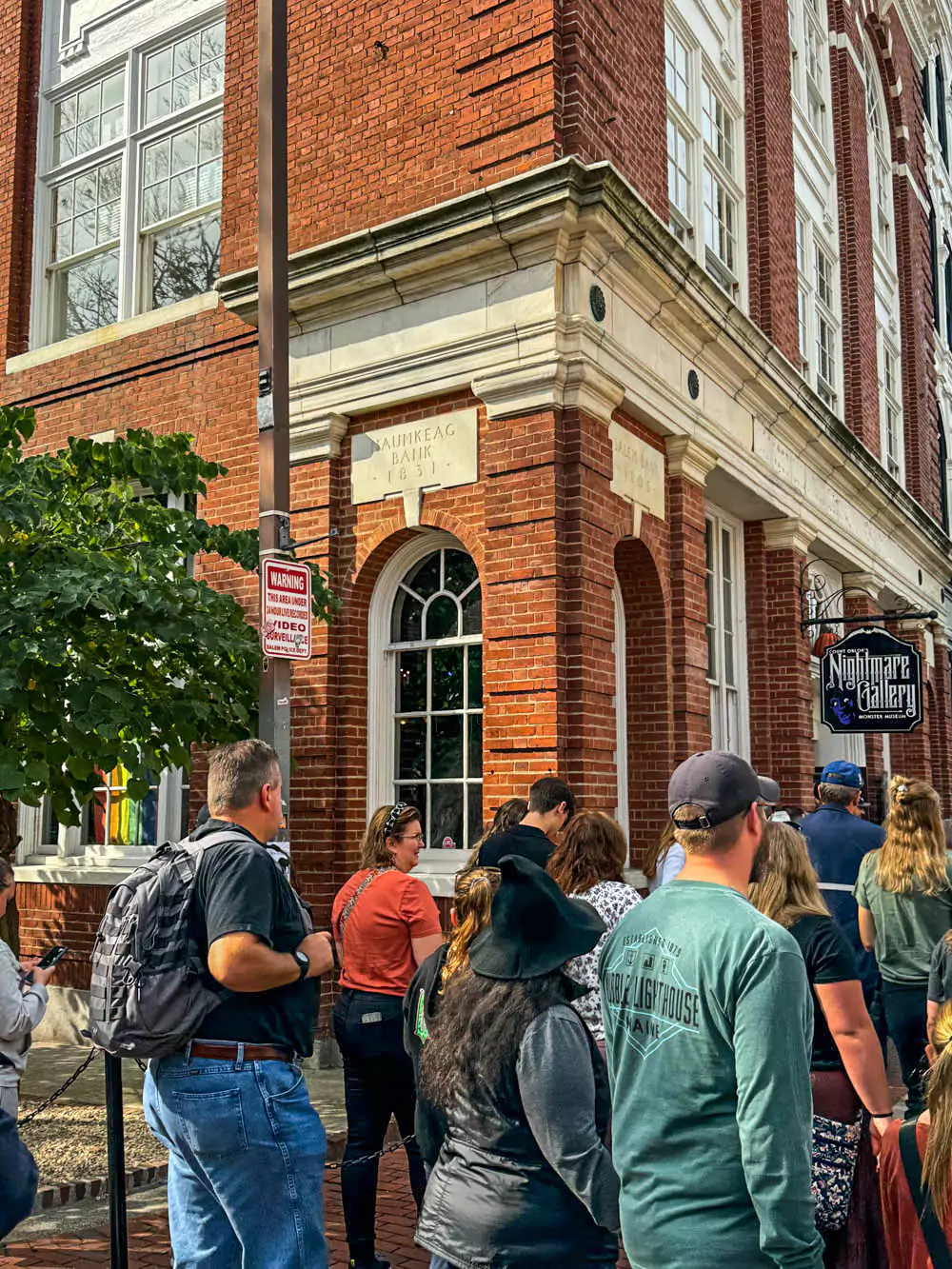 Exterior of Count Orlock’s Nightmare Gallery in Salem, Massachusetts, with dark, gothic signage and spooky window displays featuring horror movie icons. The haunted museum sets a chilling tone for fans of classic and modern monsters.