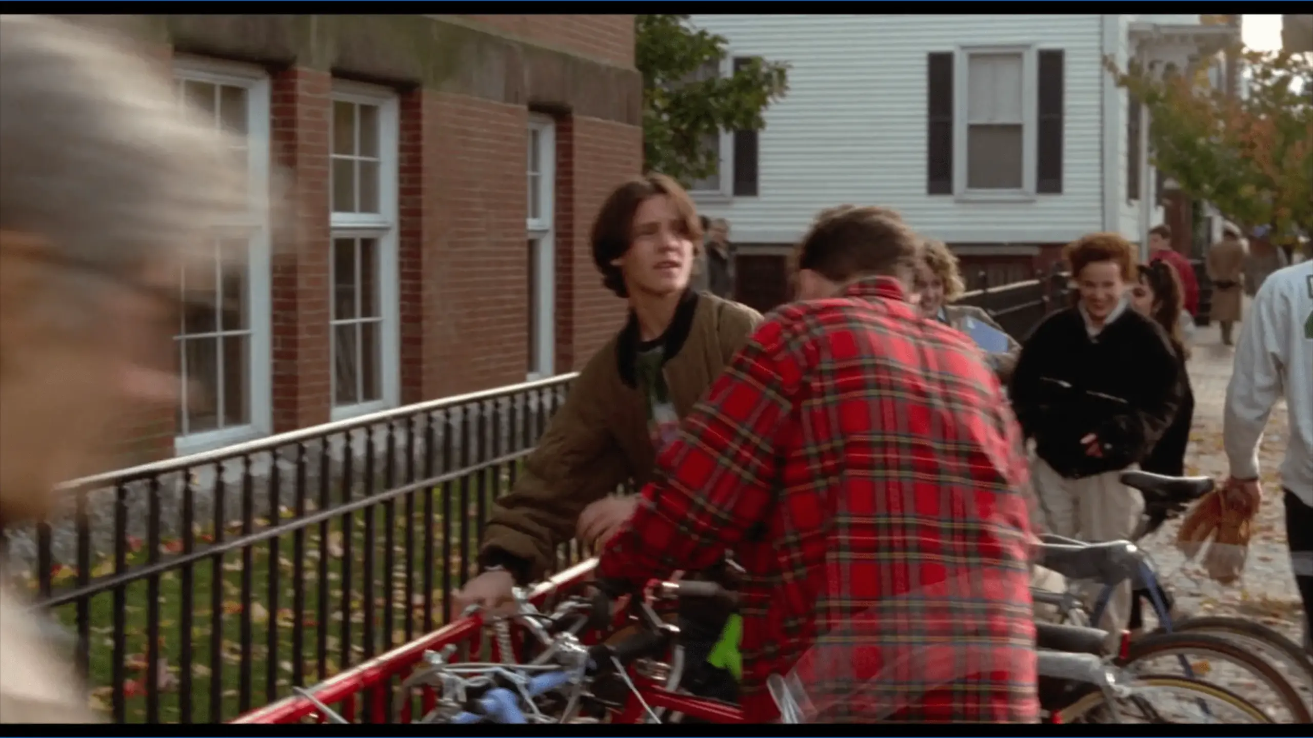 Max stands on Salem Common in front of the red-brick Phillips Elementary School. The scene blends Salem’s historic school setting with the playful spirit of the iconic Halloween movie.