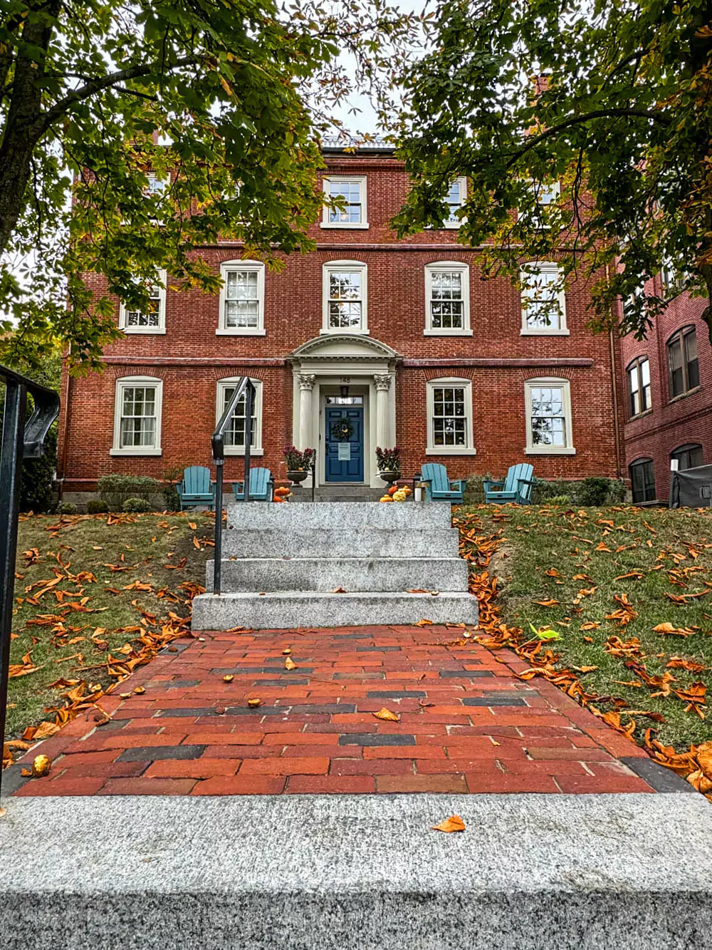 The historic Joshua Ward House in Salem, Massachusetts, featuring a classic Georgian-style red brick facade with white-trimmed windows and a centered doorway. The well-preserved mansion reflects 18th-century architecture in the heart of Salem.