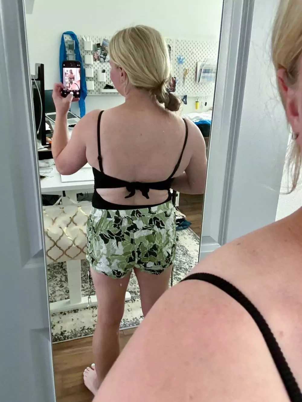Black one-piece swimsuit back view.