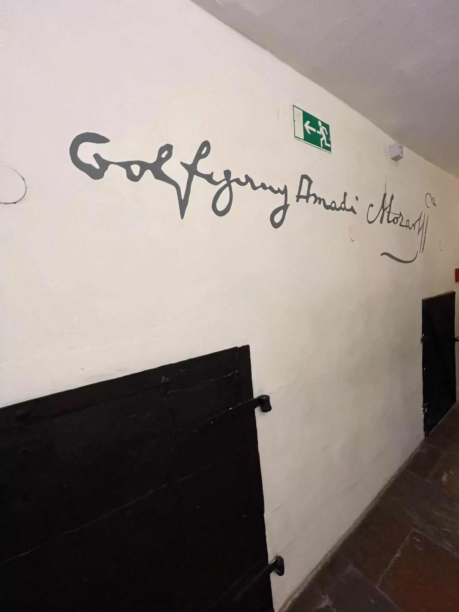 Mozart’s signature displayed on the wall at his birthplace in Salzburg, Austria, elegantly written in flowing script. The iconic autograph connects visitors to the legendary composer’s personal history and legacy.