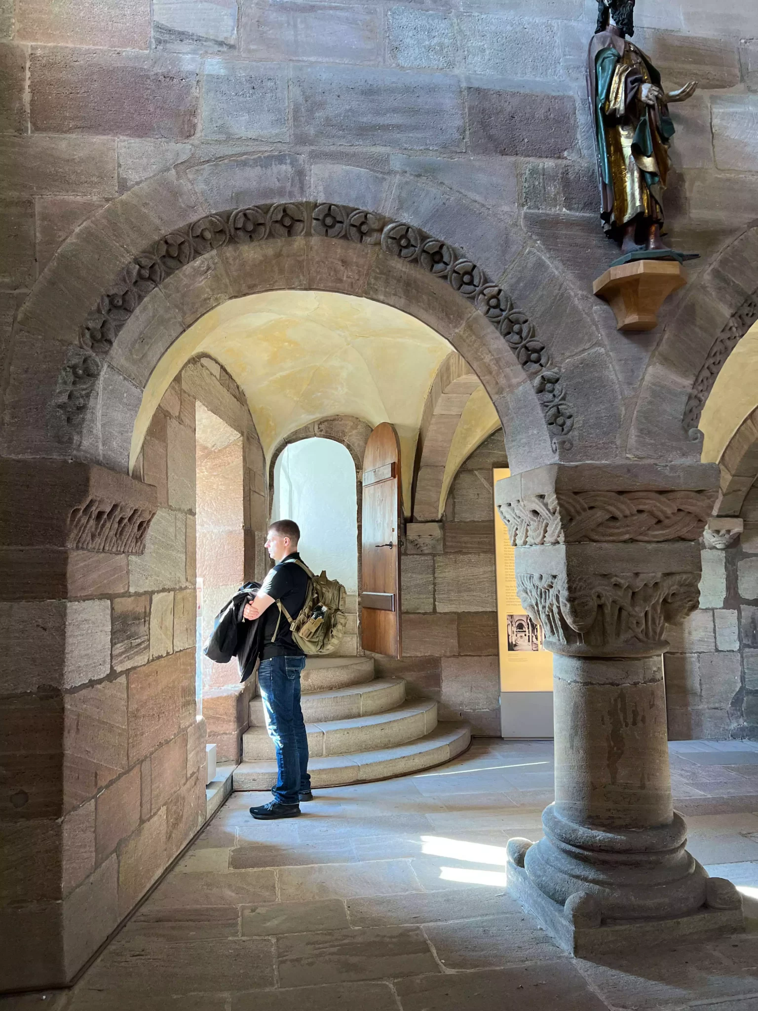 Zack looking out a window inside the Chapel