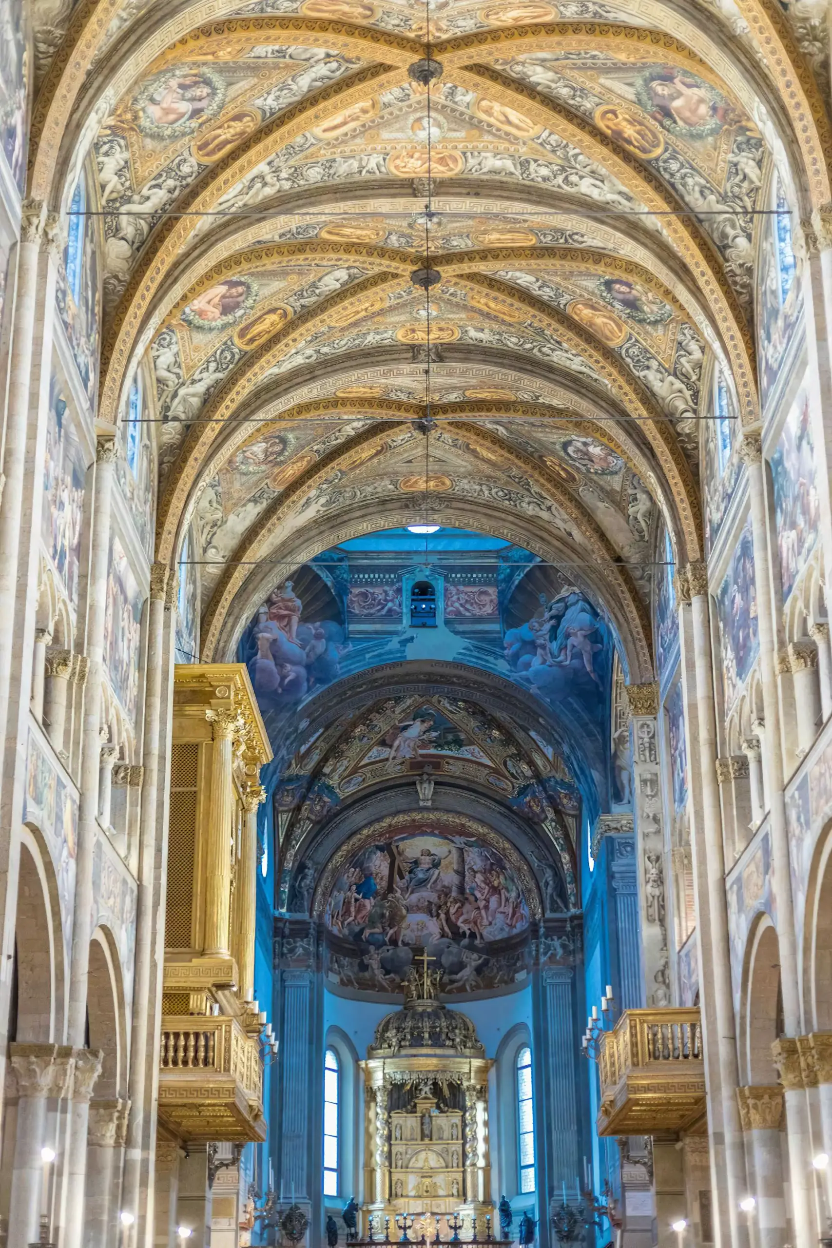 Historic center of Parma, Italy, featuring the Romanesque Parma Cathedral and pink marble Baptistery surrounded by cobblestone streets