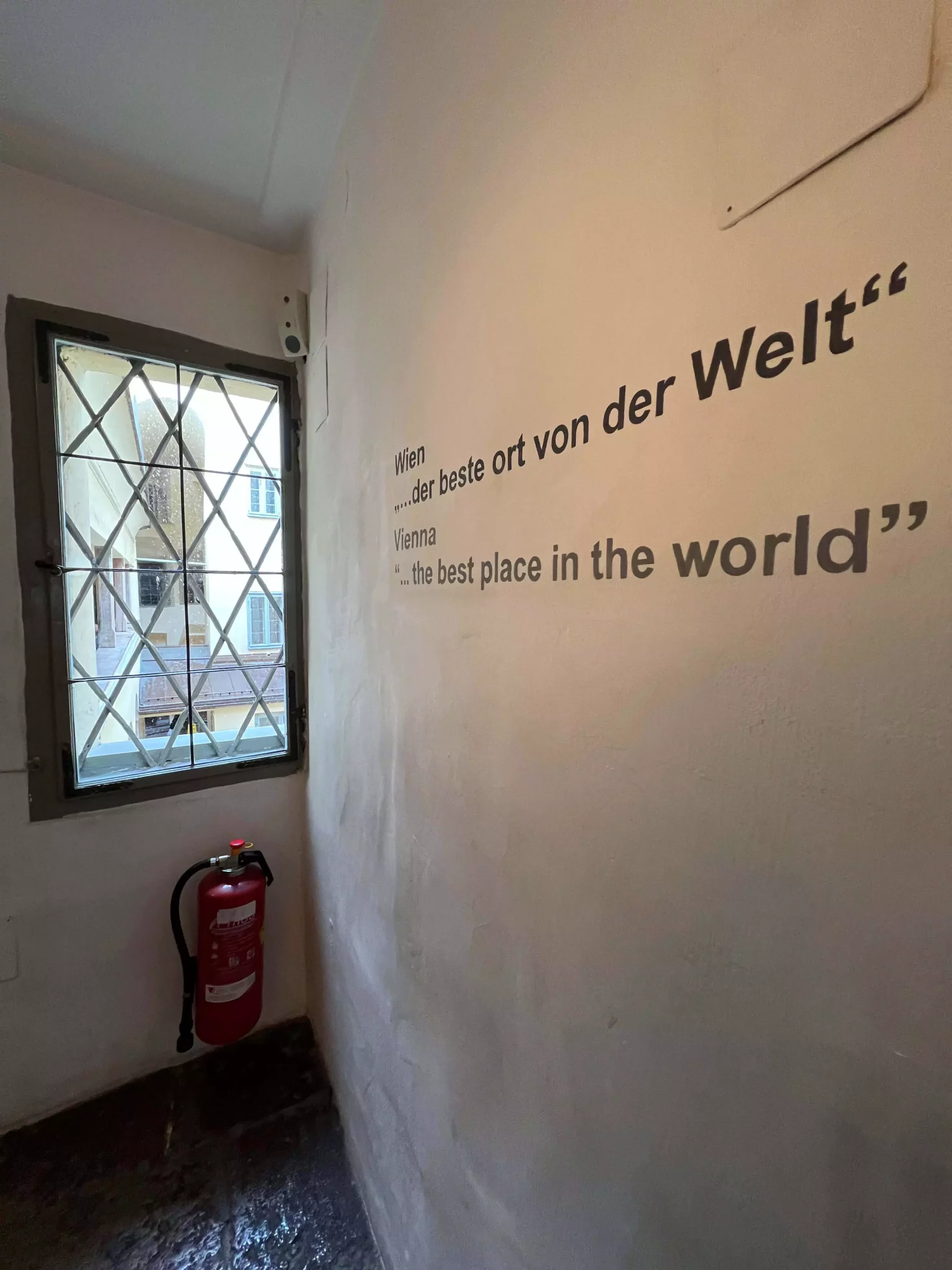 A wall at Mozart’s Birthplace in Austria displays the bold phrase “Vienna the best place in the world” in playful, handwritten lettering. The statement adds a lighthearted, modern touch to the historic site.
