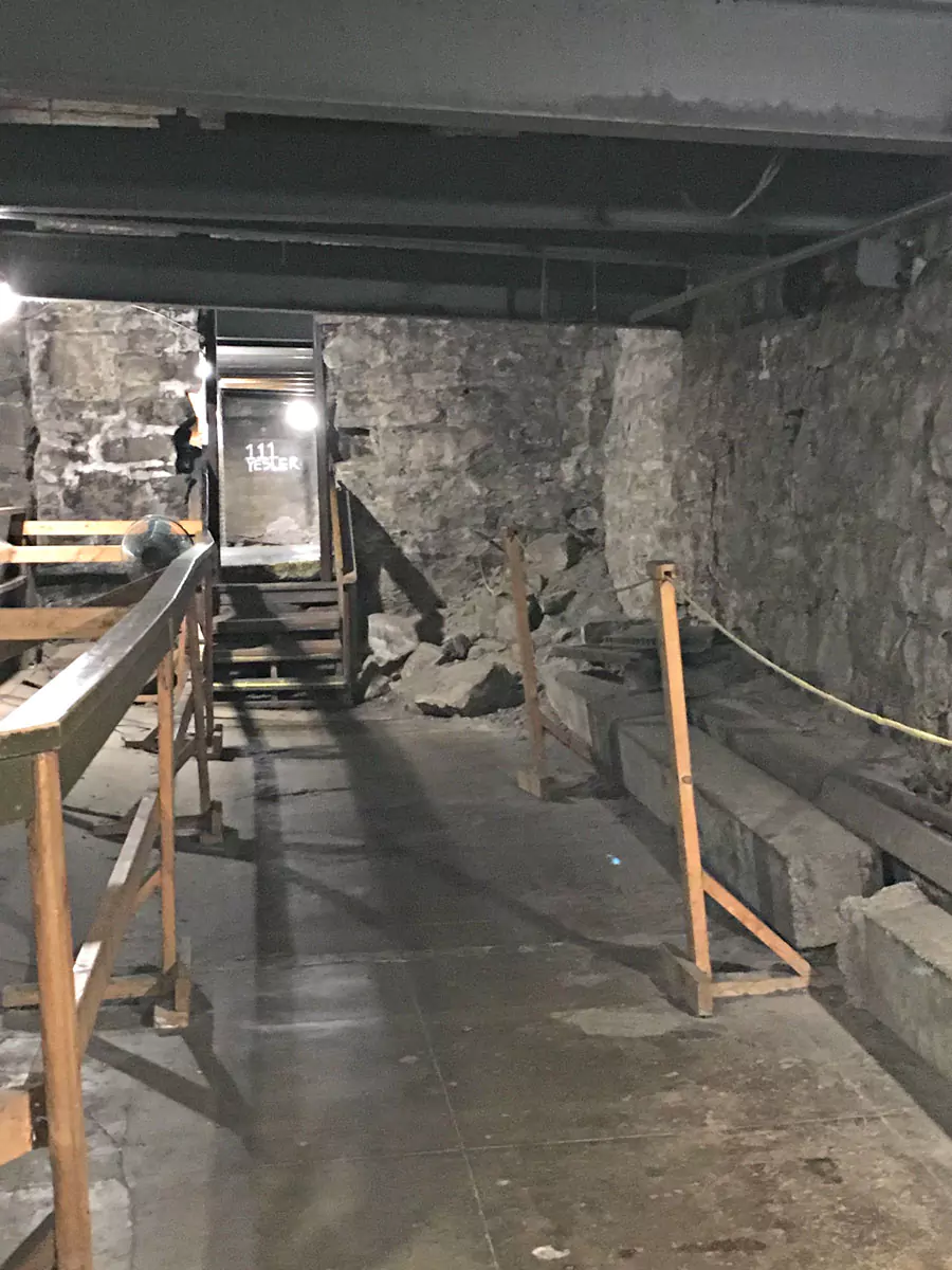 Entrance to the Seattle Underground Tour, featuring vintage signage and a staircase leading down to the historic passageways beneath Pioneer Square. The dimly lit brick tunnels reveal the city’s hidden past and original street level from the 1800s.