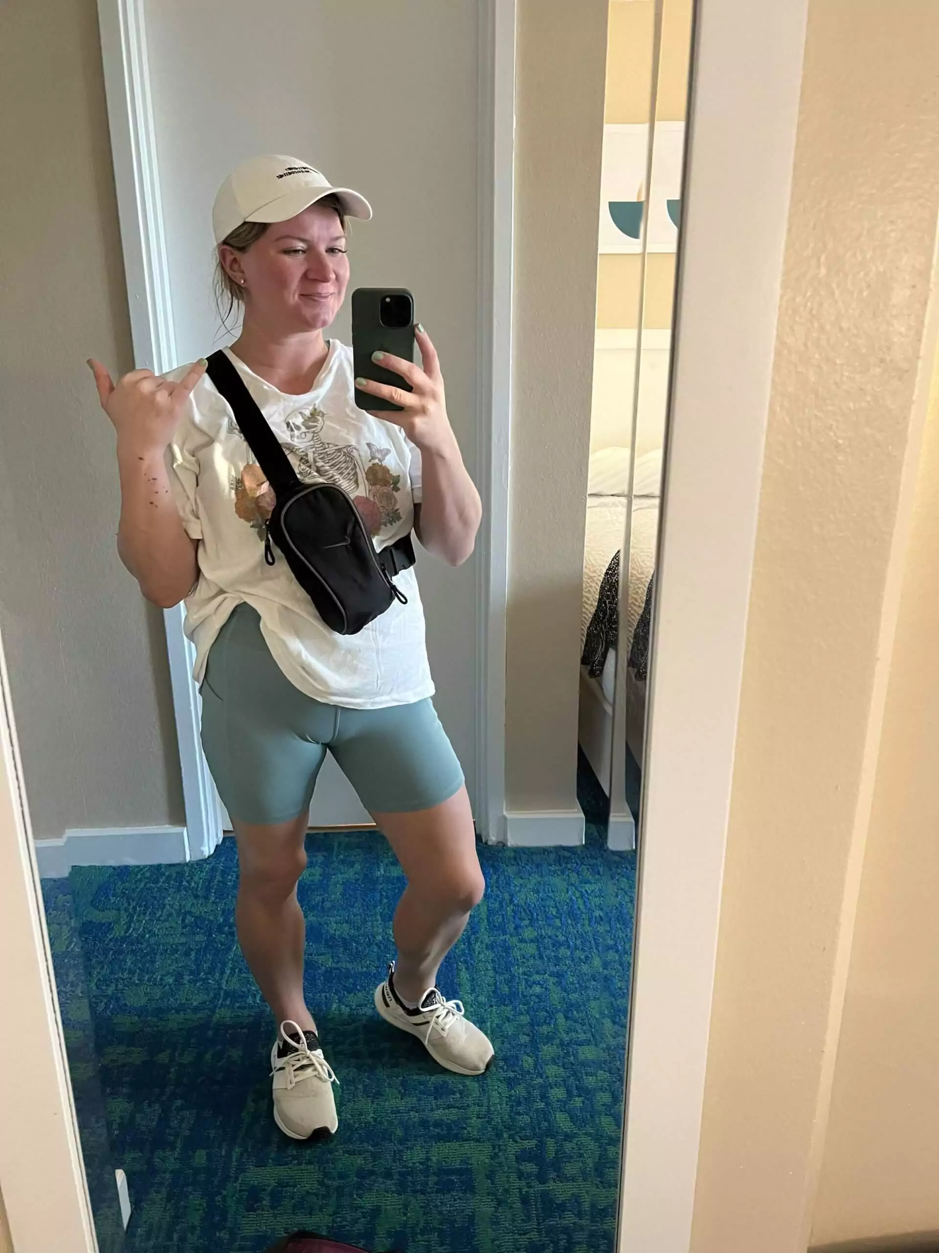 Hiking outfit for Diamond Head in Hawaii, featuring breathable activewear like a tank top, athletic shorts, sturdy sneakers, and a hat for sun protection.