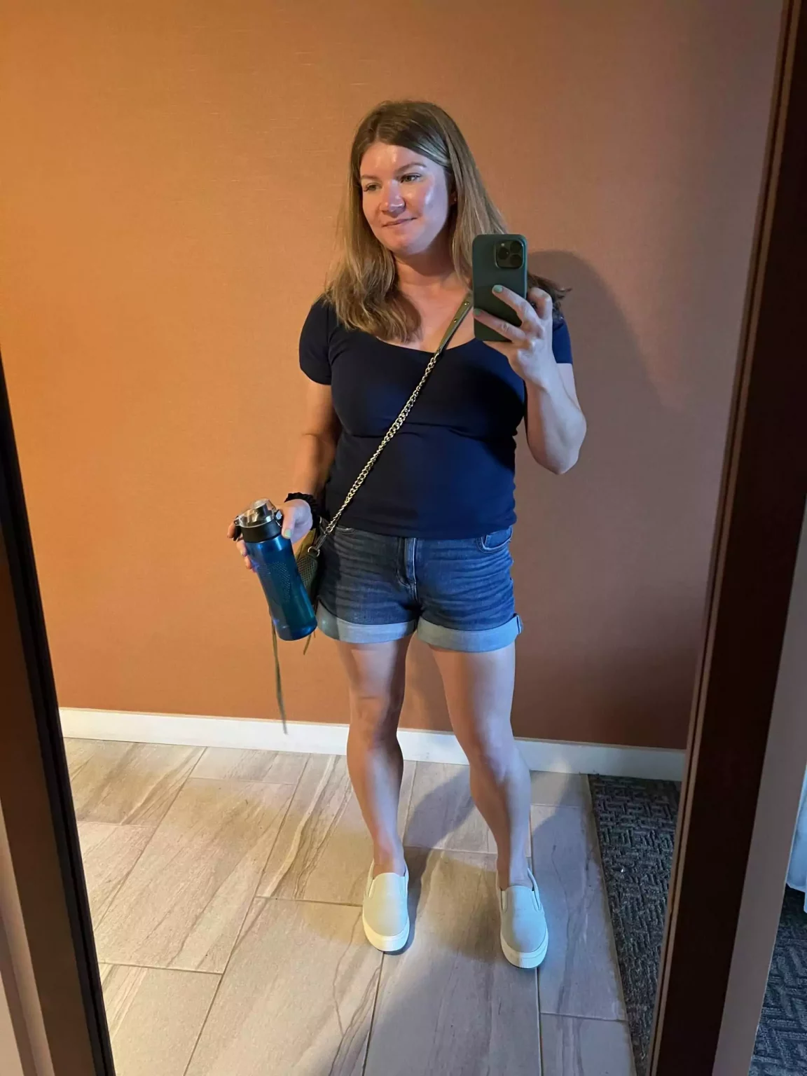 Outfit for exploring the Lāna‘i Cat Sanctuary in Hawaii, featuring casual, breathable clothes like a T-shirt, shorts, and comfortable walking shoes.