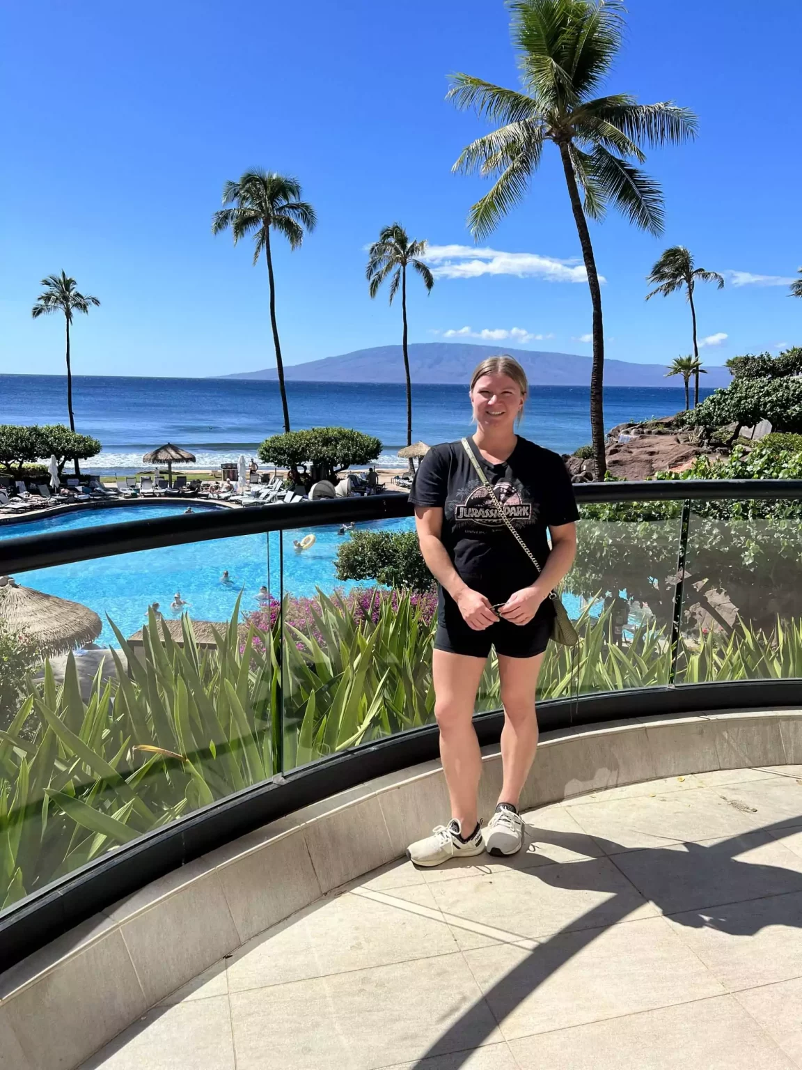 Katie dressed for a Maui helicopter ride in Hawaii, wearing a lightweight jacket, fitted top, and pants with closed-toe shoes for safety and comfort. Her practical yet stylish outfit is perfect for staying comfortable while enjoying panoramic aerial views of the island.