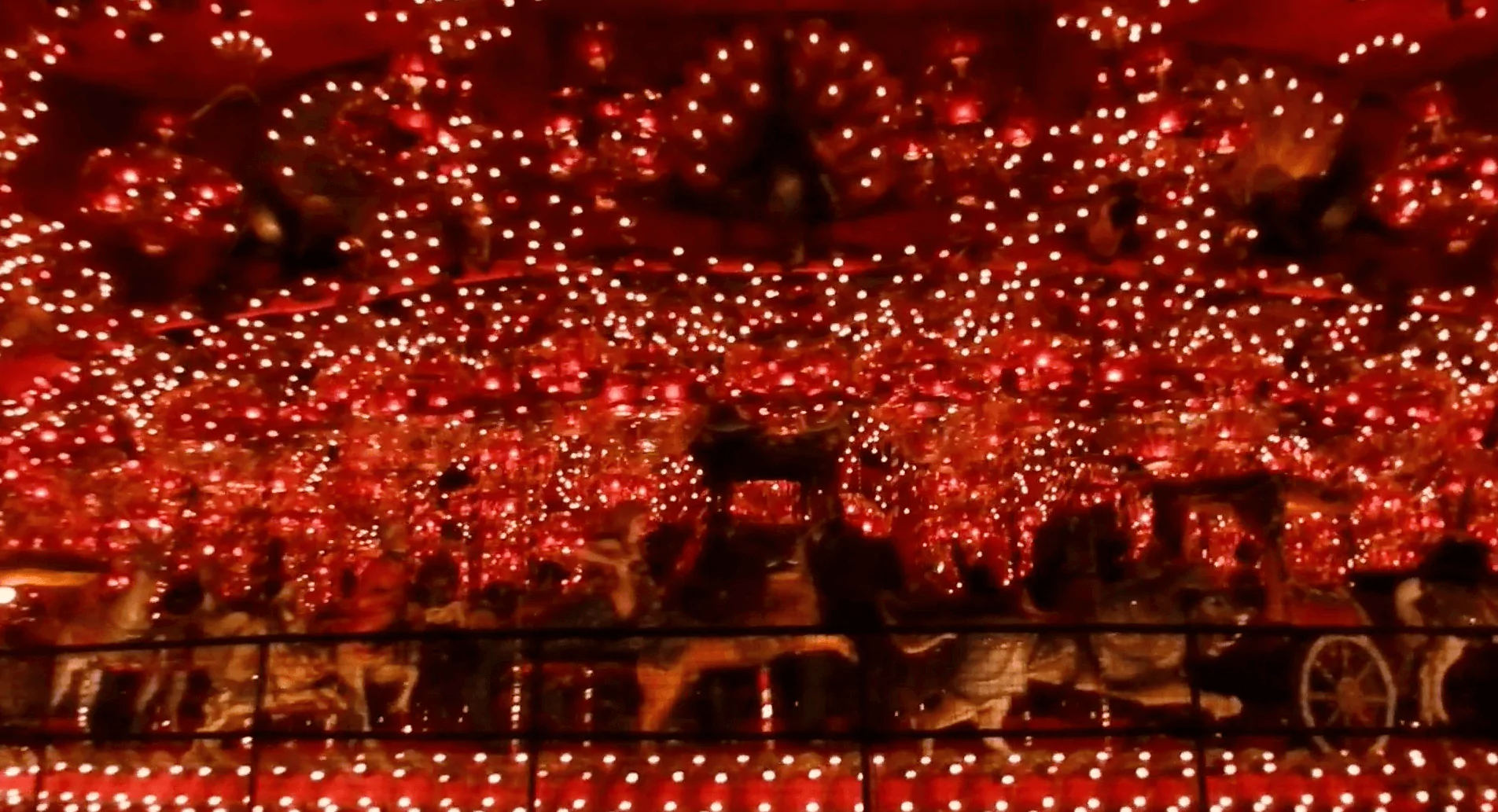 Colorful carousel inside the House on the Rock in Wisconsin, filled with ornate animals and glowing lights, showcasing one of the most extravagant weird Wisconsin roadside attractions.