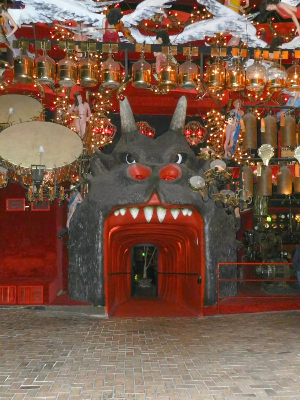 Dimly lit tunnel at the House on the Rock in Wisconsin with shadowy walls and eerie atmosphere, adding to the strange allure of weird Wisconsin roadside attractions.